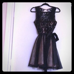 A lovely black lace and nude silk homecoming dress